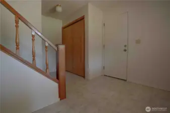 Split level entry way. 2 bedrooms with living space below. 2 bedrooms with main kitchen and living room above & more !   Garage entry to the right.