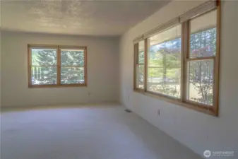 Upper living room with view of surrounding property.