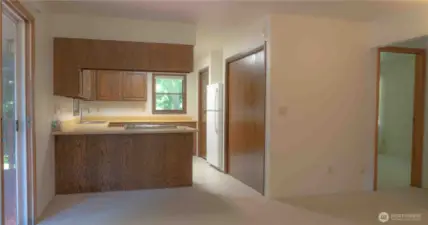 Kitchen with master bedroom & bath to the right. Second bedroom also to the right.