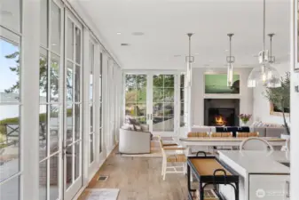 Walls of Pella Architectural Series glass frame the views, while Lutron Sequoia automated shades modulate light with effortless elegance.