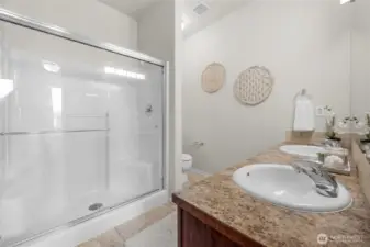 5 ft Primary Suite Shower with built-in seat.