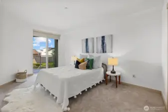 Guest bedroom with access onto outdoor deck area