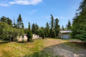 Three bedrooms/2 baths/1755 square feet on 4.36 acres and a huge shop too