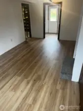 Entry way to storage on the left and utility room and door to exterior straight ahead.