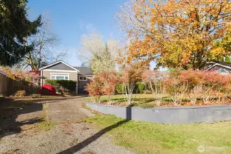 Terraced front yard with mature hedge, plus the setback of the home provide added privacy.
