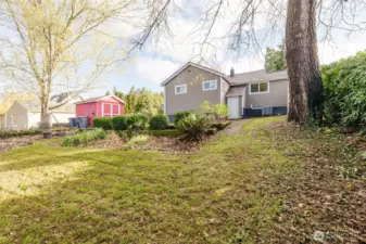 Foliage along the fence provides a backyard oasis.