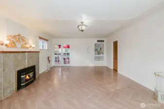Living area flows through pretty French doors into your kitchen.