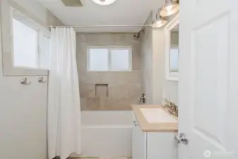Main level bathroom has been fully updated, with lots of natural light.