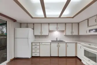 Another view of kitchen. All appliances included. Slider to the left leads to garage access.