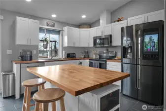 An open, inviting kitchen with island makes living and entertaining a breeze.