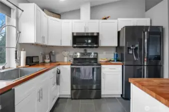 Plenty of cabinet and counter space. Large, deep sink and designer faucet.