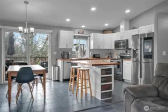 The dining area adjoins the kitchen.