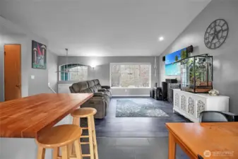 View from the kitchen to the living room with vaulted ceilings.