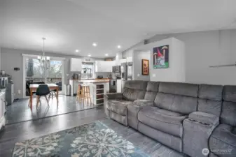 View from living room toward kitchen and dining spaces.