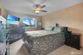 Primary bedroom is on the upper level and has a full bath attached and walk-in closet.