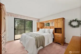 The primary bedroom will comfortably accommodate a queen size bed with a grand headboard and a couple of pieces of bedroom furniture.