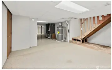 The stairway from the hallway from the laundry room lands here.  It's a versatile space.  Keep it utility?  Create a living area?  Your choice.