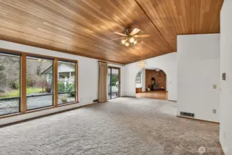 Large windows look out to the patio and the private setting.