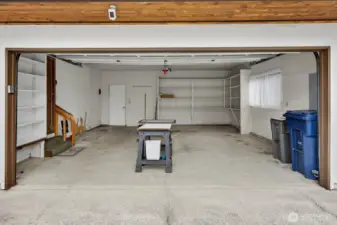 Attached 2 car garage with door opener and key pad.