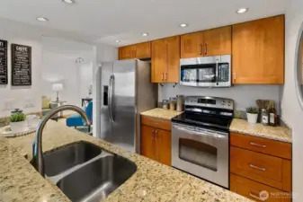 Well appointed kitchen features granite counters