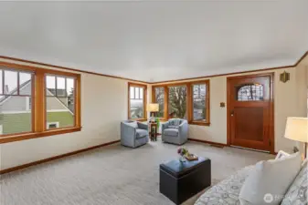 Living room windows let in the water view overlooking the shipyard and ferries