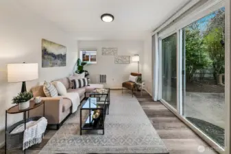 South-facing windows fill the family room with natural light while overlooking the private backyard and garden setting. Thoughtfully positioned on the south side of the home, this living space enjoys bright exposure and peaceful views of the landscaped backyard.