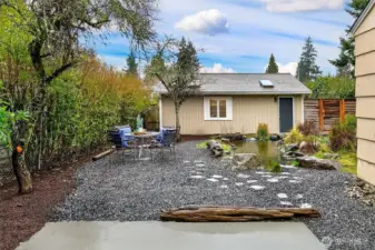 Sliding doors open directly to the garden patio, creating a seamless indoor-outdoor flow ideal for summer evenings and weekend entertaining.