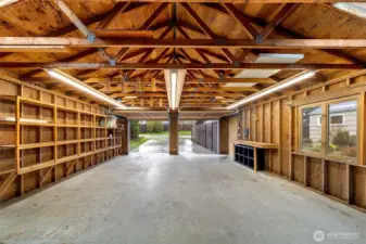 Cathedral ceilings and expansive open space transform the oversized detached two-car garage into more than just parking, an ideal setting for projects, hobbies, creative pursuits, or future possibilities.