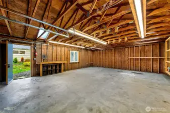 With generous proportions and soaring ceilings, the detached garage offers flexible shop space that easily adapts to storage, workspace, or weekend tinkering.