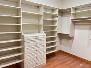 A place for everything in this well organized walk in closet.