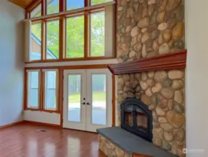 Wall of windows/French doors optimize the natural light.