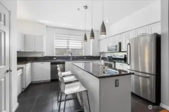 The kitchen has solid granite counter tops, stainless steel appliances.