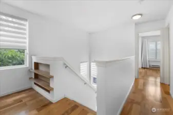 Built ins at the top of stairs at the bedroom level.