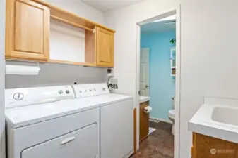 The utility room has abundant storage, includes a sink and opens to the main bathroom. Besides the well placed and generously sized windows, skylights make this a light and bright home year round.