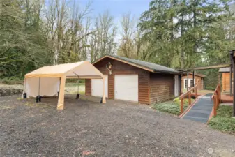 Besides the spacious garage, the portable carport will remain with the home. It also has sides and a front you can put on, should you wish to do so. Everything you can want is already in place. Move in and celebrate life every day!