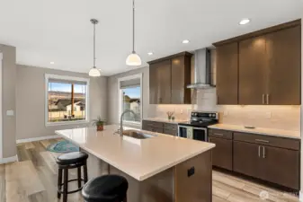 Spacious kitchen with convenient bar seating for casual dining.