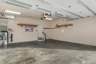 Spacious and deep two-car garage with room for storage.