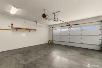 Spacious and deep two-car garage with room for storage.