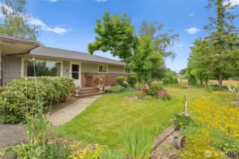 Lots of established landscaping including fruit trees for your enjoyment.