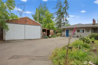 Plenty of storage on this property with several outbuildings. This is one of the bigger shop spaces with a lien-to.