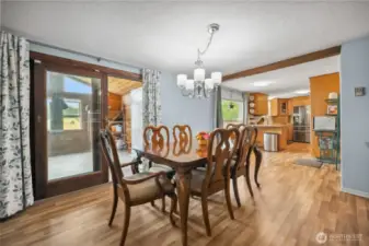 Sliding door leads to bonus space and back composite deck.
