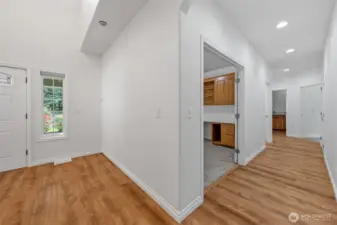 Front door area looking down hallway from family room