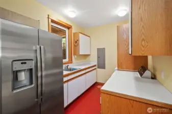 Laundry room on main floor with door to portico