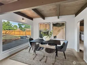 Dining room off the living room and connected to the kitchen via pocket door