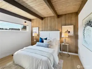 1 of 3 bedrooms. Large window lets in natural light while maintaining privacy.
