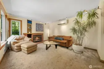 Inviting living room has a wood burning fireplace~