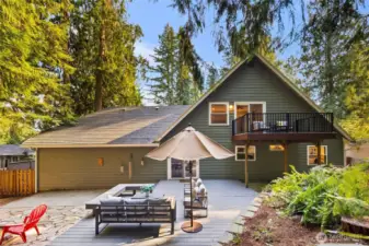 The home features a durable rubber roof, built over the existing composite roof approximately 10–12 years ago, designed as a 50-year roof. It includes metal flashing along the valleys for added protection. The roof was inspected by Squatch Roofing of Woodinville. Gutters were replaced in 2023 with extra-wide, leaf-guard gutters by High Point Roofing, who also cleaned and serviced them on 8/21/2025.