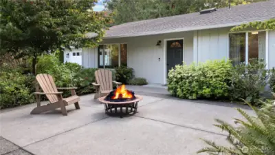 Amazing landscaping front and back at this home, and I love this front patio/firepit area.