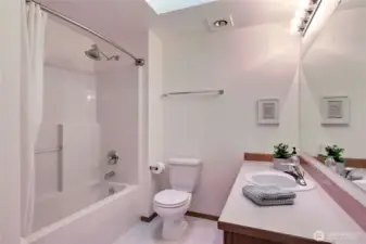 Kids/Guest full bath. Love the skylight and heat lamp!
