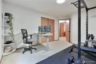 Bedroom #3, currently used as an office and workout room. Weight set can stay!
